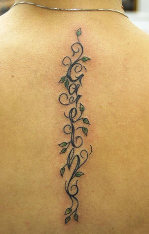 Text and vine tattoo on the spine - Tattooimages.biz